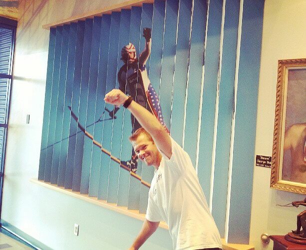 Siemers poses next to his photo on the USA Water Ski Museum